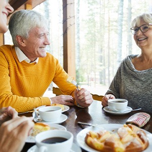 Group of adults eating a meal indoors