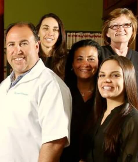 The smiling dentists and team members at Medford Dental Arts