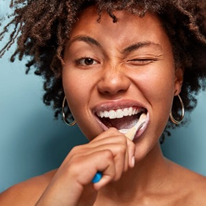 Woman brushing her teeth
