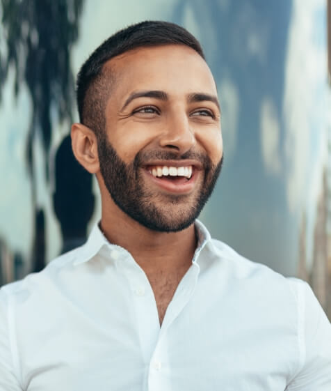 Man with a bright smile thanks to teeth whitening in Medford